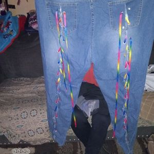 Ripped jeans with rainbow lace up on the back of pants